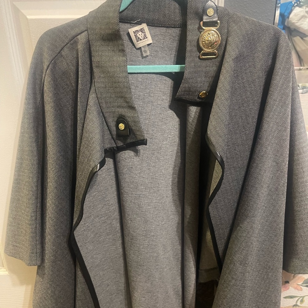 Unique poncho very few times almost new can be wear in winter and fall